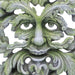Green man leafy figurine shown up close on the face