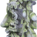 Green man leafy figurine shown from the side, showing acorns
