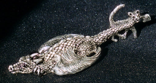 pewter cat dragging a dragon by the tail