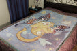 Starry Butterfly Cat tapestry blanket shown on a bed