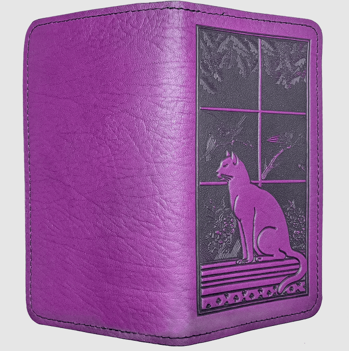 Cat in windowsill leather checkbook cover shown open from the back