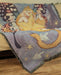 Starry Cat tapestry blanket shown draped upon a couch
