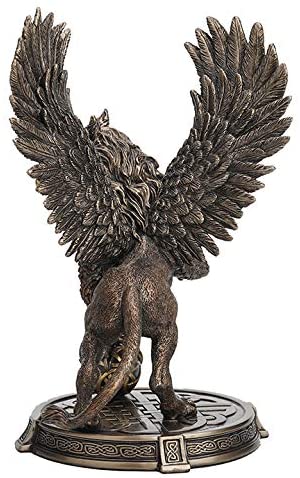 Back view - Griffon figurine - wings spread and rearing up with one claw on a Celtic knotwork sphere. With more Celtic knot designs on the base
