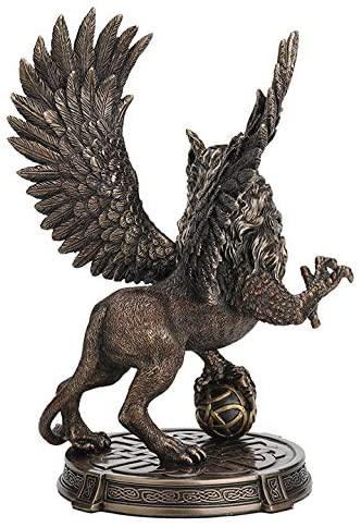 Griffon figurine - wings spread and rearing up with one claw on a Celtic knotwork sphere. With more Celtic knot designs on the base. Back view