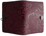 Leather journal with all over dragon design, shown in wine