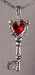 Key necklace made from pewter and inlayed with a heart shaped gem at the handle.