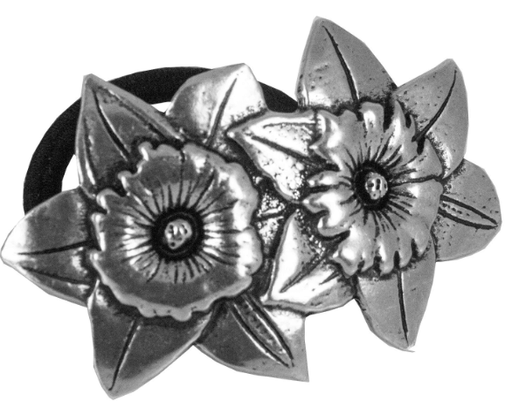 Two pewter daffodils on a ponytail holder