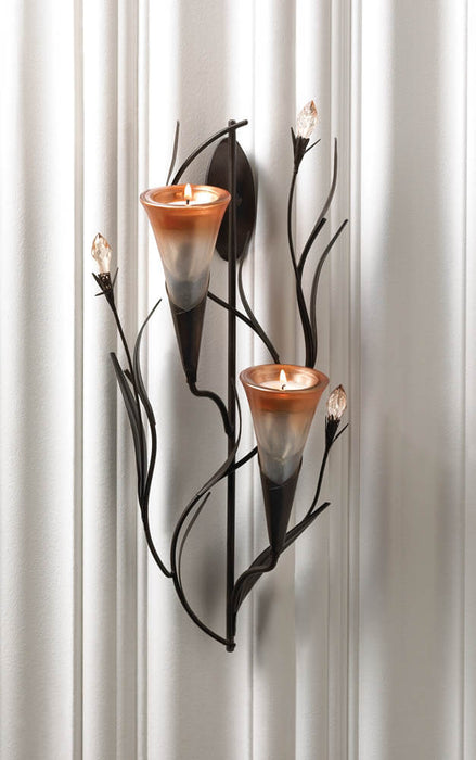 Double lily candle holder sconce with tealights displayed against a white backdrop