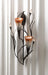 Double lily candle holder sconce with tealights displayed against a white backdrop