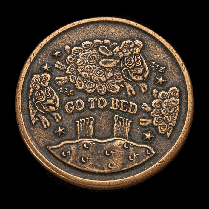 Other side of the copper book lover's coin for decision making, with leaping sheep and the text "Go To Bed"