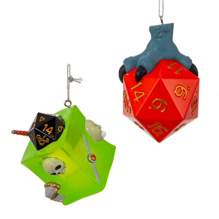 Dungeons & Dragons ornament set featuring a green gelatinous cube with items like skull, treasure chest, sword, dice, etc inside. Second ornament is a red twenty sided dice held by a grey three-toed claw