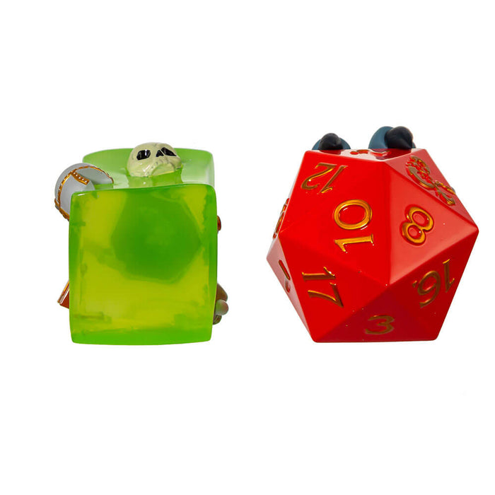 Dungeons & Dragons ornament set featuring a green gelatinous cube with items like skull, treasure chest, sword, etc inside. Second ornament is a red twenty sided dice held by a grey three-toed claw. Bottom view