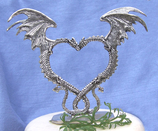 Nuzzling dragons with wings in the shape of a heart wedding cake topper 