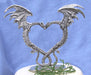 Nuzzling dragons with wings in the shape of a heart wedding cake topper 