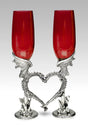 Red wedding dragon heart flutes nestling together in the shape of a heart 