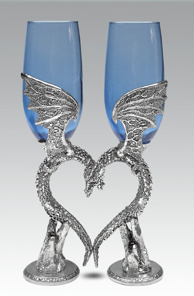 sapphire blue colored wedding wine glasses with two dragons as the stem and based positioned in the shape of a heart.