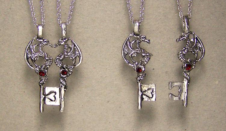 dragon pair neckalces inlayed with gems on a key that fits together