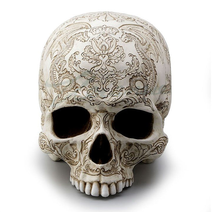 Front view of Skull with dragon and thistle engravings 