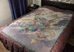 Bl;ue Steampunk dragon tapestry displayed on a bed