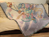 Blue steampunk dragon tapestry shown draped over a couch