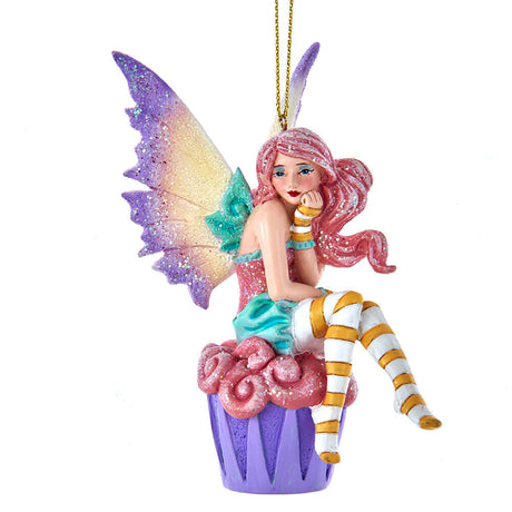 Amy Brown fairy ornament with pixie sitting on a cupcake, wearing pink, green, orange and white.