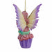 Back view of Amy Brown fairy ornament with pixie sitting on a cupcake, wearing pink, green, orange and white.