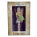 Amy Brown fairy ornament with pixie in pink, green, yellow, blue and white holding a Christmas tree cookie. Shown in window box