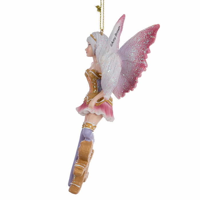 Side view of Fairy ornament by Amy Brown with pink wings and shirt, brown and purple accents, and a gingerbread man