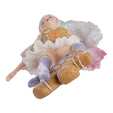 Bottom view of Fairy ornament by Amy Brown with pink wings and shirt, brown and purple accents, and a gingerbread man