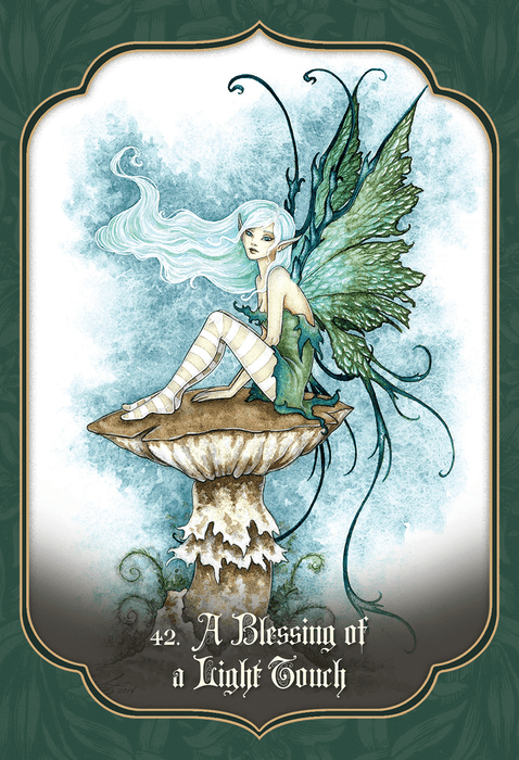 Card example. Text reads "42. A Blessing of a Light Touch" and art shows a pixie with green wings and light blue hair sitting on a mushroom