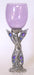 purple colored wine glass with fairy standing inlayed with gems for base and stem