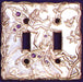 pewter double fairy switch plate with two fairies that have gems inlayed in wings and flower vines growing around them