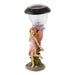Side view of fairy solar lamp for garden walkway - fairy has pink dress and wings and stands with flowers