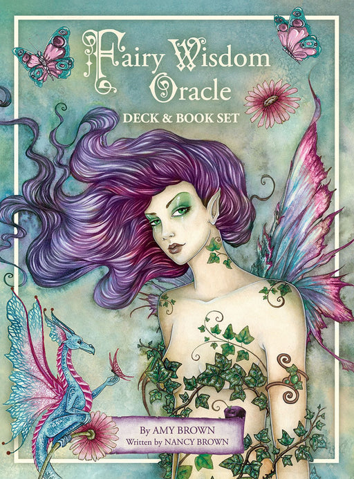 Fairy Wisdom Oracle Deck & Book Set front cover with a purple-haired fairy clad in ivy leaves, accompanied by a blue and pink dragon. By Amy Brown, Written by Nancy Brown