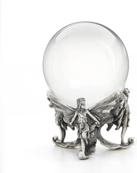 Three fairies holding up a crystal ball made of glass