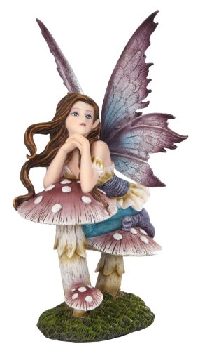 A brunette fairy with purple and blue wings and dress leans on some spotted toadstool mushrooms