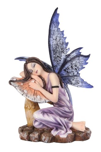 Fairy with purple wings and a lilac dress, sleeping on a toadstool