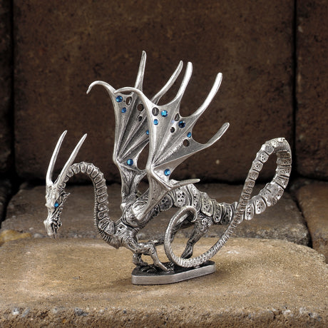 Pewter dragon with blue crystals in wings and eyes