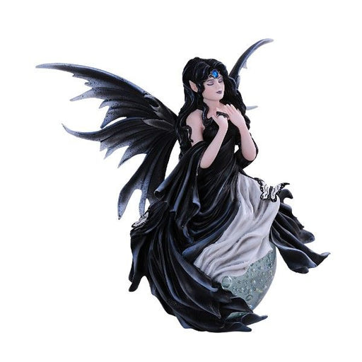 A fairy in a black and white dress with ebony wings and hair sits upon a translucent bubble. A butterfly rests upon her leg