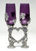 purple colored glass wine flutes with pewter grape vine wrapped around and positioned to form a heart.