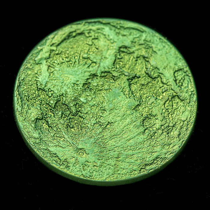 Green full moon coin, one side shown