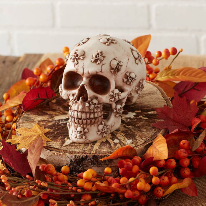 Skull with more skulls displayed in a autumn centerpiece