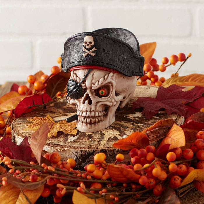 Pirate skeleton with hat and eye patch in a festive fall leaves display for Halloween