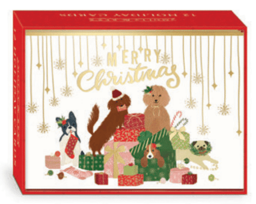 Holiday cards that read "Merry Christmas" in gold with five dogs in and around a pile of presents