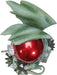 Green dragon figurine with red Christmas ornament and white berries. Shown top down