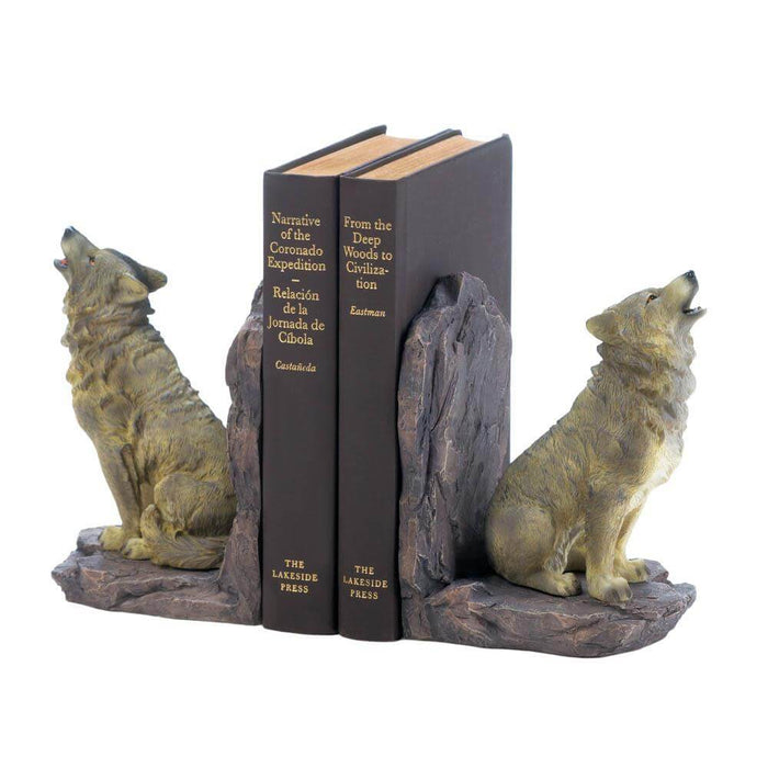 A pair of howling wolves sit on rock as the bookends with two tomes sandwiched between them