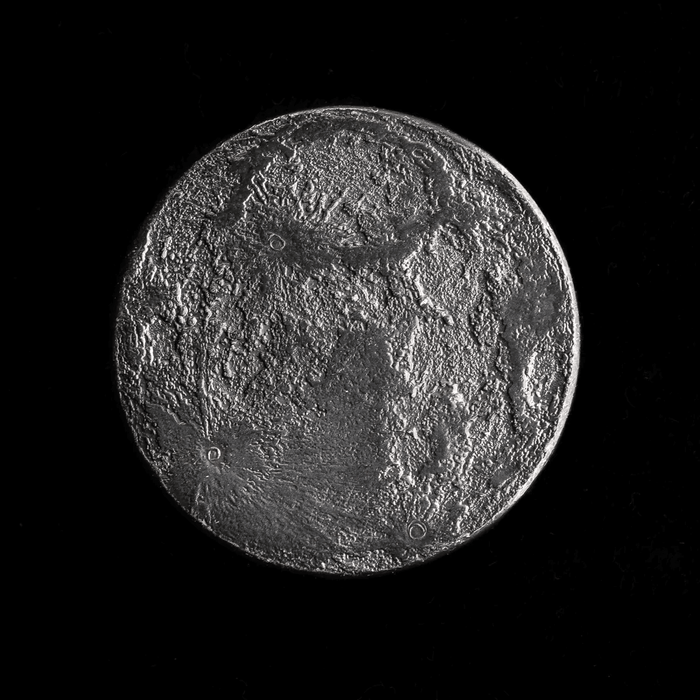 Iron full moon coin, one side