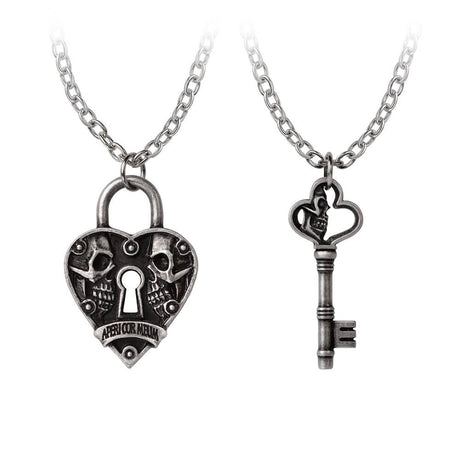 Closeup of heart-shaped lock with two skulls and key with one skull pendants