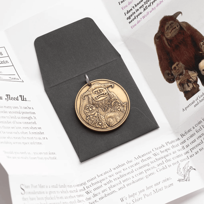 Coin pendant shown with Labyrinth packaging