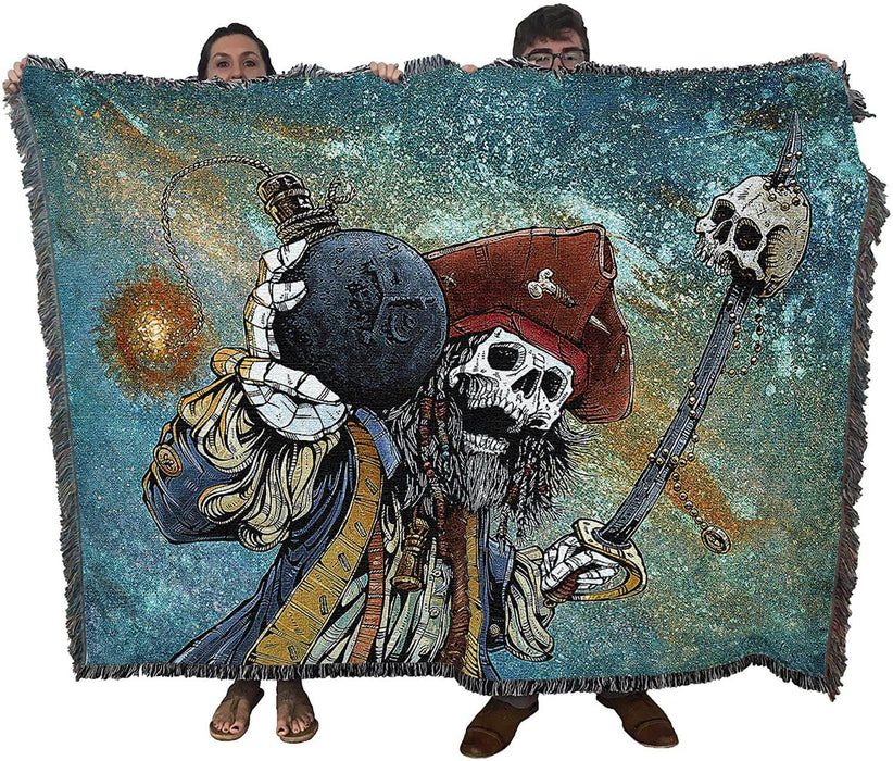 Tapestry blanket showing a skeleton pirate holding a sword with impaled skull, and a bomb. Held up by two adults to show size
